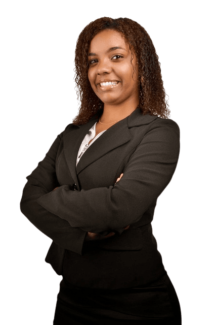 a black lady in suit wearing a smile on her face